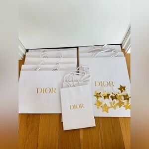 Lot of 11 Dior white pebble texture shopping bags with gold star charms
